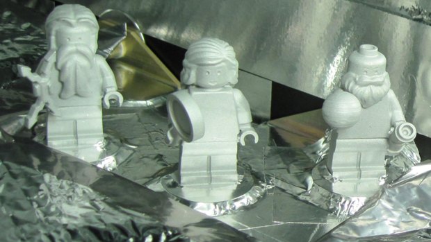 Lego figurines representing, from left, the Roman god Jupiter, his wife, Juno, and Galileo Galilei aboard the Juno spacecraft. The figures are made of aluminium so they can withstand the extreme conditions of space flight.

 