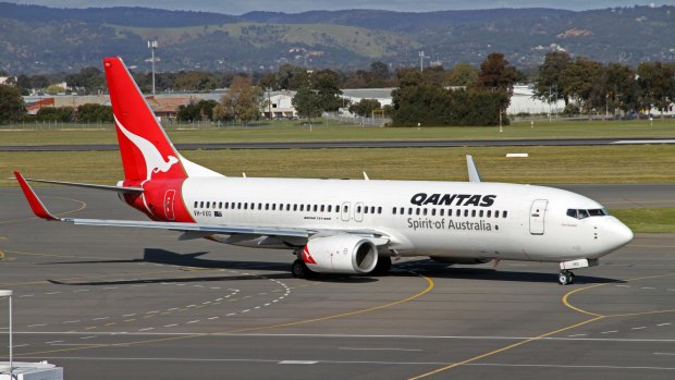 A Qantas Boeing 737-800 aircraft. The large turbofan engine requires a greater intake of air than a turbojet engine.