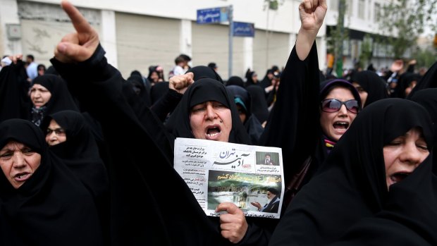 A group of Iranian worshippers chant slogans in a May demonstration over negotiations with world powers on Iran's nuclear program.