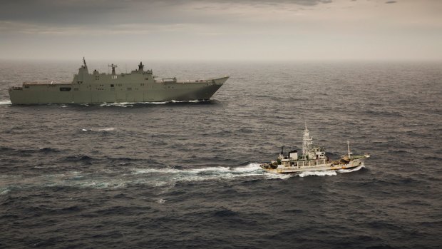HMAS Adelaide escorts the former Japanese whaling vessel towards Hobart in December.