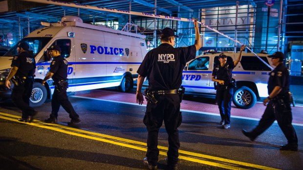 Police arrive on the scene of the explosion in Manhattan's Chelsea neighborhood on Saturday night.