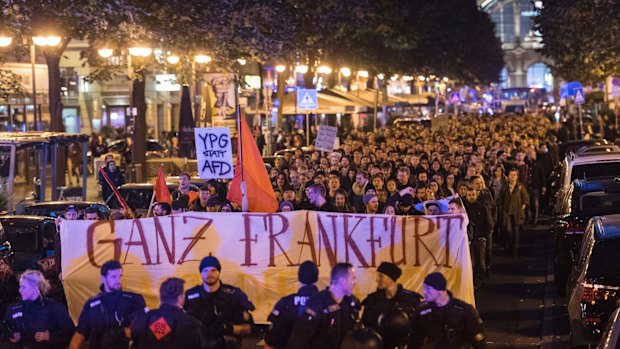 Demonstrators protest against the nationalist Alternative for Germany Party, AfD, after parliament elections in Frankfurt, Germany.