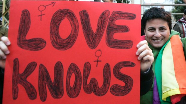 A gay-rights protester holds a banner in Beirut, Lebanon, in 2009.