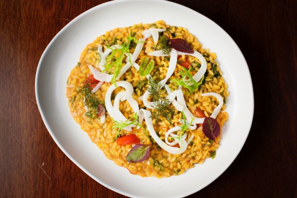 Saffron risotto, cuttlefish, cherry tomato and sea vegetables.