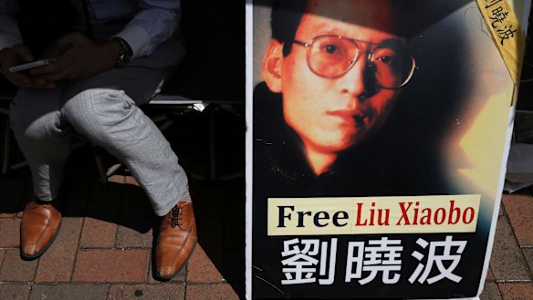 A protester displays a portrait of jailed Chinese Nobel Peace laureate Liu Xiaobo during a demonstration in Hong Kong earlier this month.