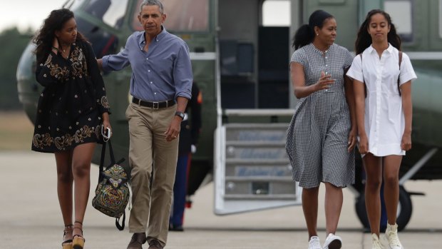 US President Barack Obama with first lady Michelle Obama and their daughters Malia, right, and Sasha.