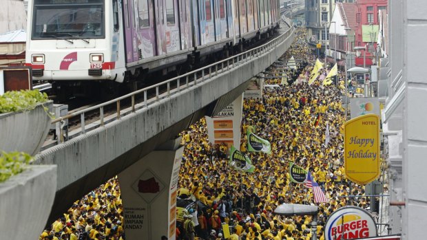 Supporters of pro-democracy group "Bersih" gather as they prepare to march to Dataran Mederka in Malaysia's capital city of Kuala Lumpur.