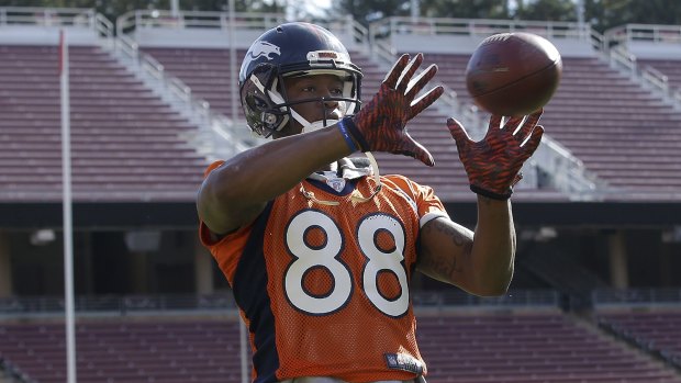 Shaky hands: Demaryius Thomas practices on Thursday - he has dealt with dropping the ball too many times all year.