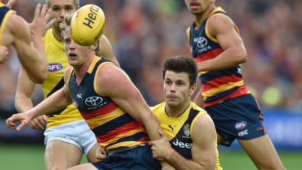 Deciding factor?: Trent Cotchin and Rory Sloane will be pivotal in the midfield battle during the grand final.