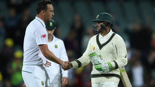 Respect: Kyle Abbott of South Africa congratulates Khawaja at the end of play.