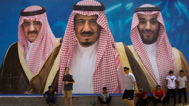 A billboard showing King Salman, centre, his son Mohammed bin Salman,  right, and former heir Mohammed bin Nayef in Taif, Saudi Arabia.  