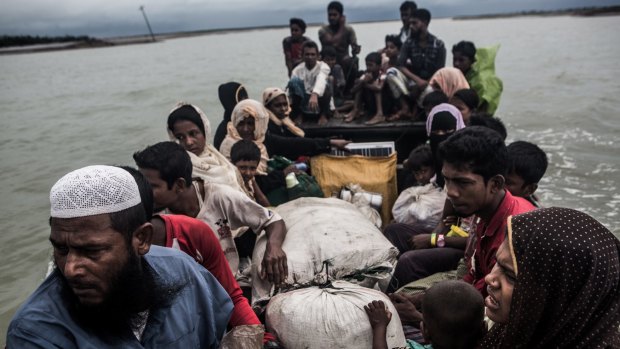 Rohingya refugees arrive in Teknaf, Bangladesh by boat from Myanmar on September 28.