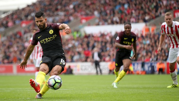 Manchester City's Sergio Aguero scores his side's first goal – from the penalty spot – against Stoke on Saturday.
