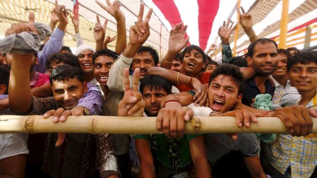 Supporters of India's Prime Minister Narendra Modi cheer during a rally in Mathura on Monday.
