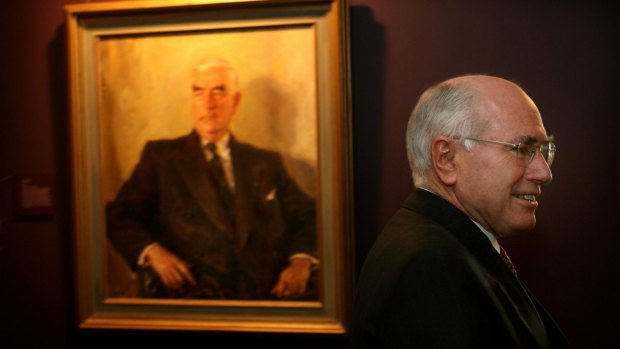 John Howard with a portrait of Menzies at Old Parliament House.