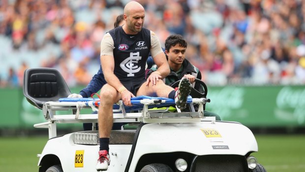 Chris Judd leaves the ground after injuring his knee against the Crows.