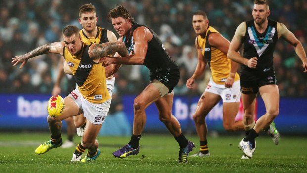 Dustin Martin leads the chase last night but coach Damien Hardwick says the Tigers race is over.
