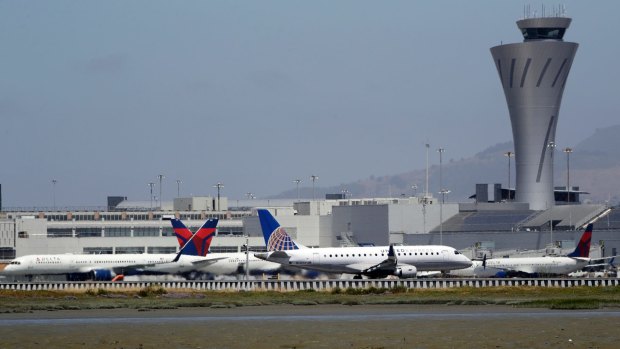 A passenger has opened an aeroplane door and jumped out prior to the plane arriving at the terminal in San Francisco.