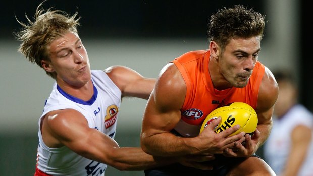 Shaen Biggs, left, competes for the ball with Stephen Coniglio of the Giants.