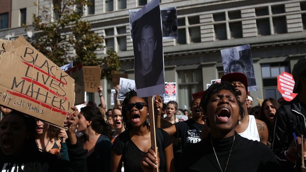 Protesters against police brutality in Oakland, California, part of a national outcry sparked by the shooting of Michael Brown in Ferguson, Missouri. 
