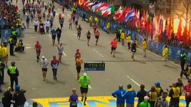 Still image taken from video courtesy of NBC shows an explosion at the Boston Marathon. 