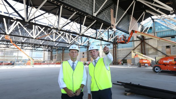 Premier Mike Baird and Infrastructure Minister Andrew Constance inspect the new roof.