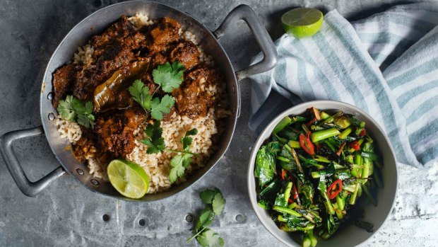 Perfect pairing: Beef rendang and turmeric greens.