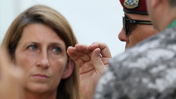 A member of the Brazilian National Force holds a bullet inside the equestrian media centre.