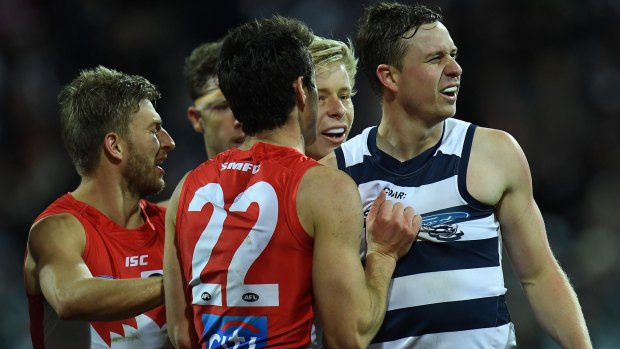 Swans remonstrate with Geelong's Mitch Duncan.