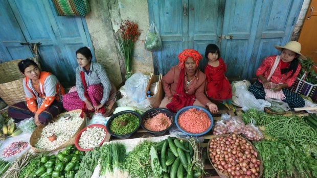 Vendors wait for customers at a local bazaar in Pindaya, southern Shan State, Myanmar.