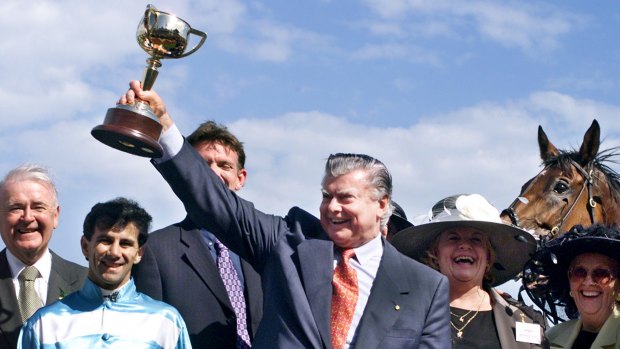 Trainer Bart Cummings lifts the Melbourne Cup after Rogan Josh, ridden by John Marshall claimed the 1999 Melbourne Cup.