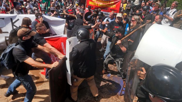 White nationalist demonstrators clash with counter demonstrators at the entrance to Lee Park in Charlottesville, Virginia, on August 12.
