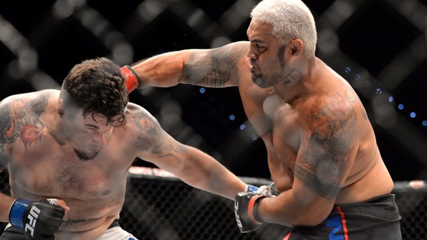 Take that:  Mark Hunt delivers the telling punch against Frank Mir during their UFC Heavyweight bout. 
