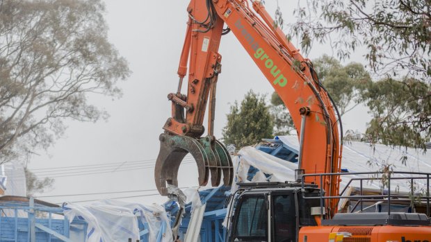 The first Fluffy demolition in Sternberg Crescent, Wanniassa, in June: The Government has now extended the scheme to including adjoining homes.