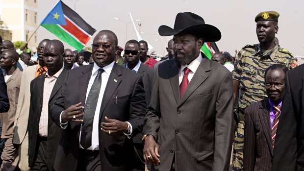 South Sudanese President Salva Kiir, centre-right, and then vice-president Riek Machar, centre-left in 2011. Mr Kiir signed a peace deal with rebel leader Mr Macher on August 26.