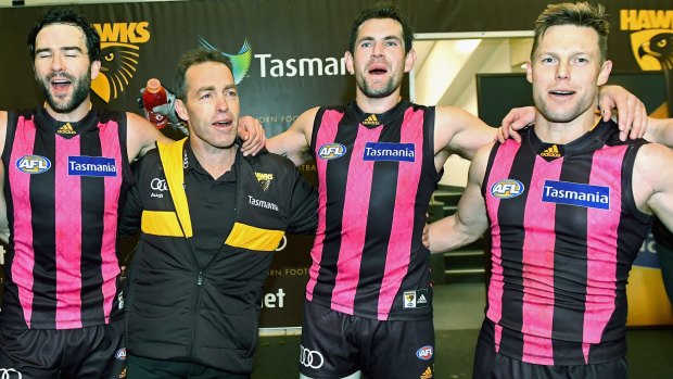 Jordan Lewis (left),  Alastair Clarkson, and Sam Mitchell (right) with Luke Hodge (second from right) in happier times.