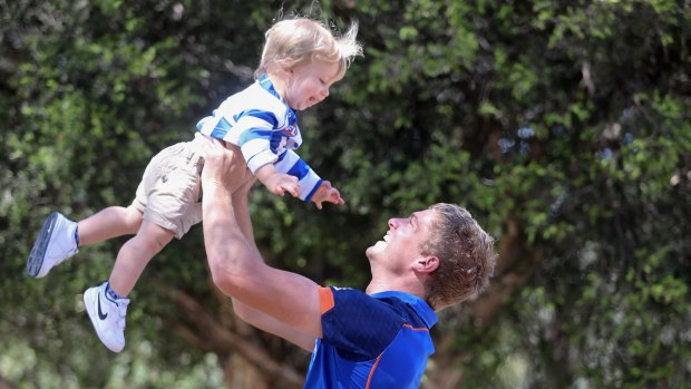 North Melbourne recruit Jed Anderson with his son Jasiah, 1. 