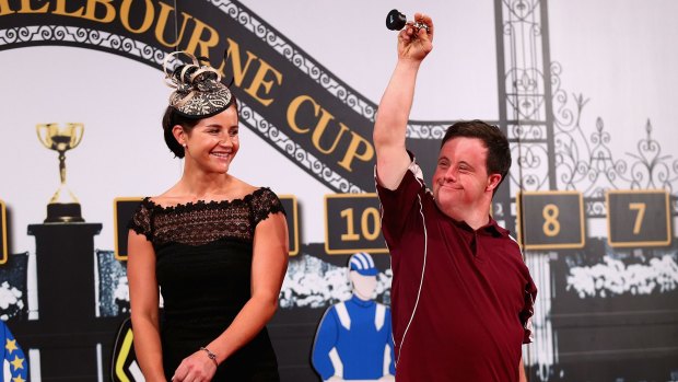 Cup of cheer: Stevie Payne reacts as Michelle Payne looks on during the Melbourne Cup barrier draw.