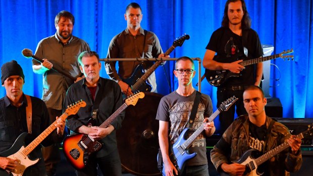 Members of the Melbourne Drone Orchestra, featuring 18 guitarists who use feedback, tones and volume to maximum effect.