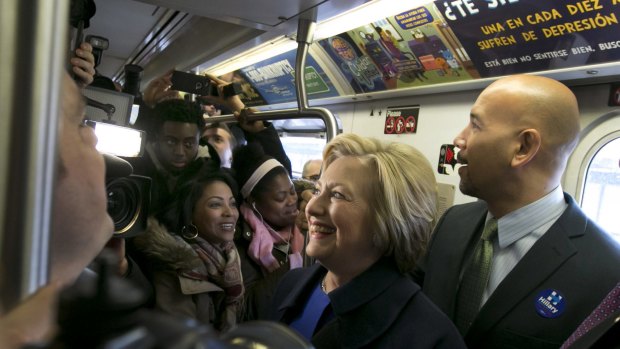 Democratic presidential candidate Hillary Clinton and Bronx Borough president Ruben Diaz jnr ride the subway in the Bronx , New York, on Thursday.