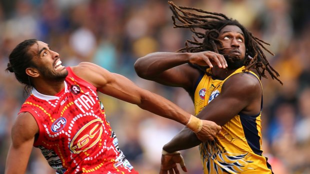 Tom Nicholls of the Suns and Nic Naitanui of the Eagles contest the ruck during the round 10 AFL match between the West Coast Eagles and the Gold Coast Suns.
