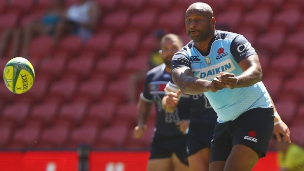 Lote Tuqiri, of the Waratahs, passes during the Rugby Global Tens match between Waratahs and Rebels at Suncorp Stadium. 