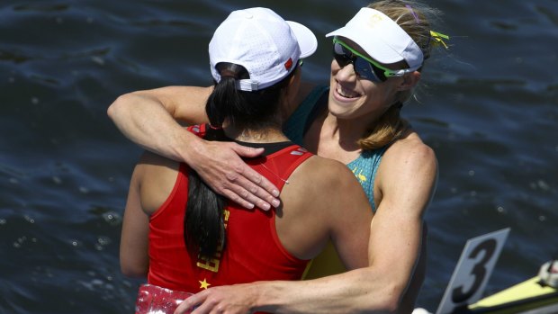 Australian gold medalist Kim Brennan and Bronze medalist Duan Jingli of China embrace after their final at Rio's Lagoa Stadium on Saturday.