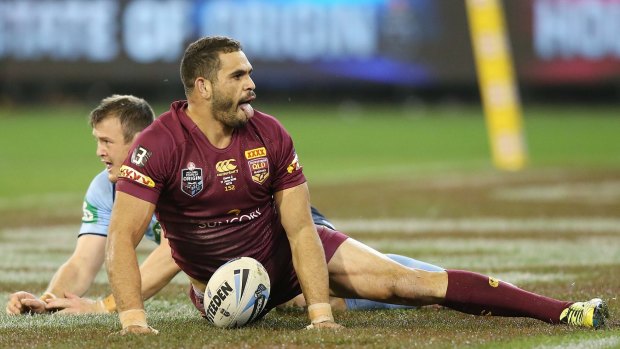 Greg Inglis of the Maroons reacts after scoring a try past Josh Morris of the Blues that was not allowed after a replay during game two of the State of Origin series between the New South Wales Blues and the Queensland Maroons at the Melbourne Cricket Ground on June 17, 2015 in Melbourne, Australia.  (Photo by Michael Dodge/Getty Images)