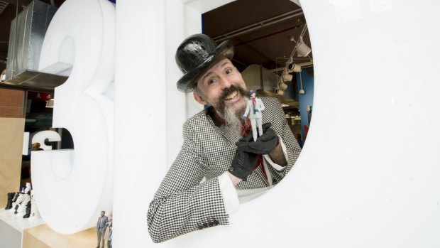 Milliner Richard Nylon gets to grips with his miniature self.