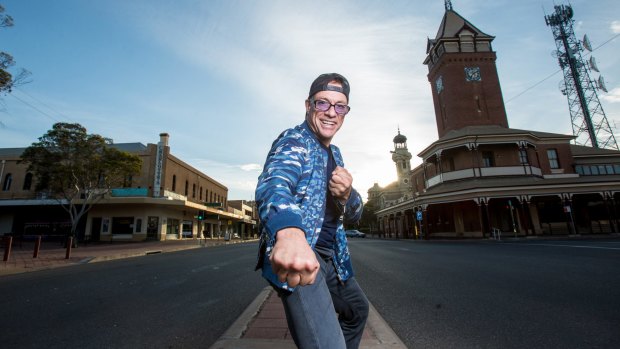 Jean-Claude Van Damme hams it up on the main street of Broken Hill.