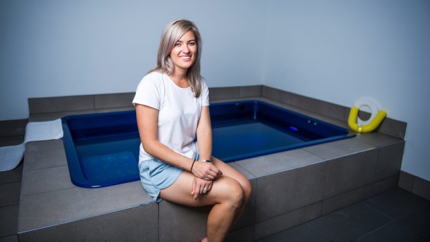 Astral Float Studio owner Sarah Tisdell with the fully accessible float bath for people with mobility issues or claustrophobia.