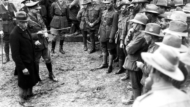 Australian Prime Minister, W.M. "Billy" Hughes and General Sir John Monash, Australian Corps Commander, speak to an informal gathering of Australian troops near Le Mesnil, France, in 1918.
