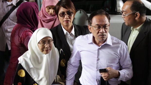 Anwar Ibrahim and his his wife Wan Azizah, left, arrive for the verdict in his final appeal against a conviction for sodomy, at the federal court in Putrajaya,Malaysia, in 2015.