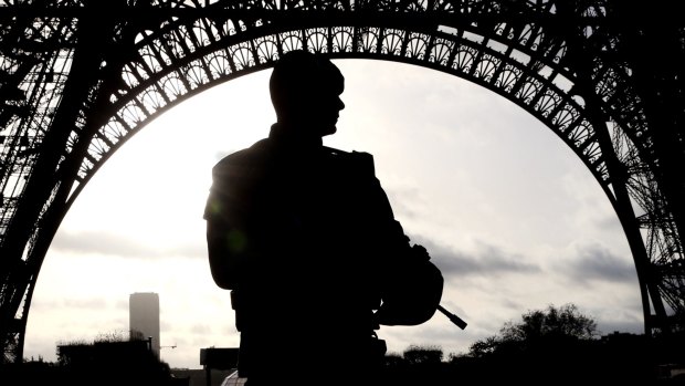 Armed military patrol the Eiffel Tower Paris France on Sunday.